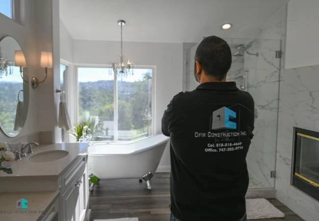 Luxury bathroom remodeling — tile walk-in shower and custom vanity in Winnetka, CA
