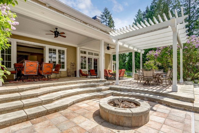 Enhancing outdoor living spaces with the best materials for patios in a serene backyard setting