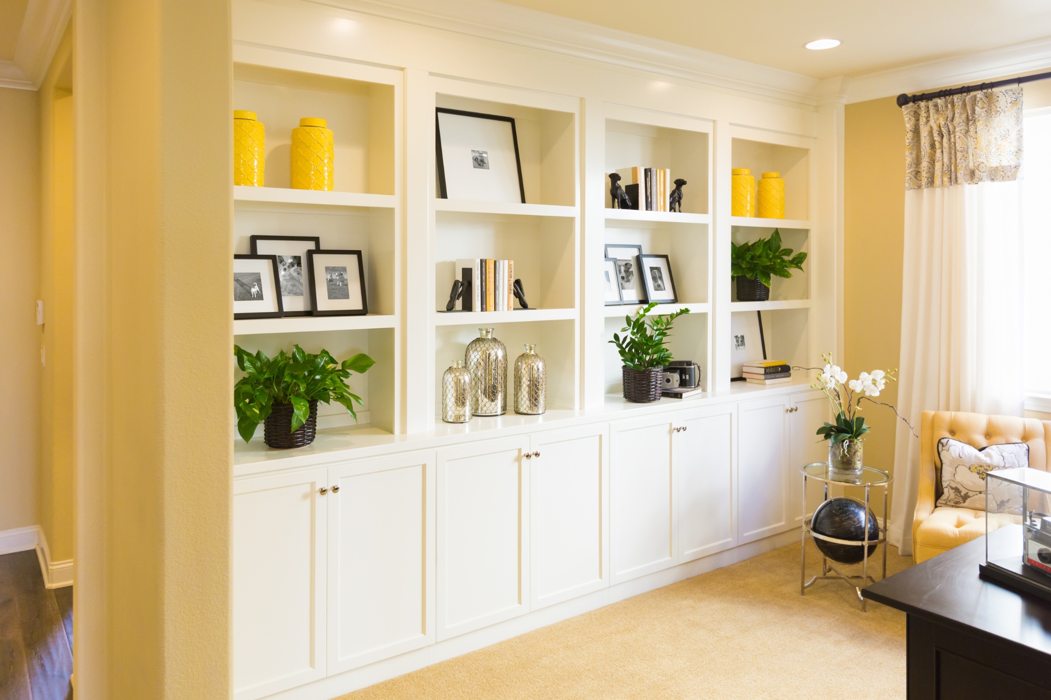 Modern living room with custom built-ins and decorative accents in a cozy home setting