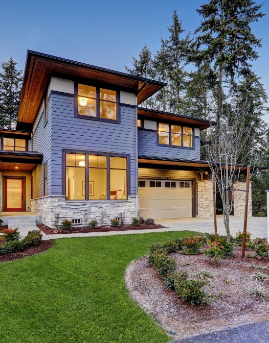 Modern residential home construction with stylish exterior and landscaped yard in a serene neighborhood setting