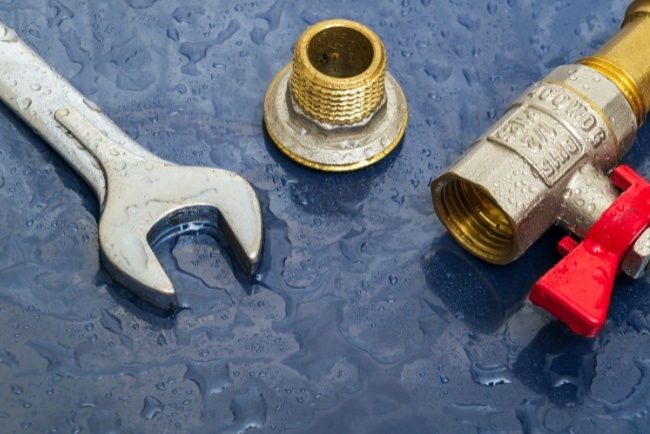 Leak detection and repair tools used for plumbing maintenance in wet environment