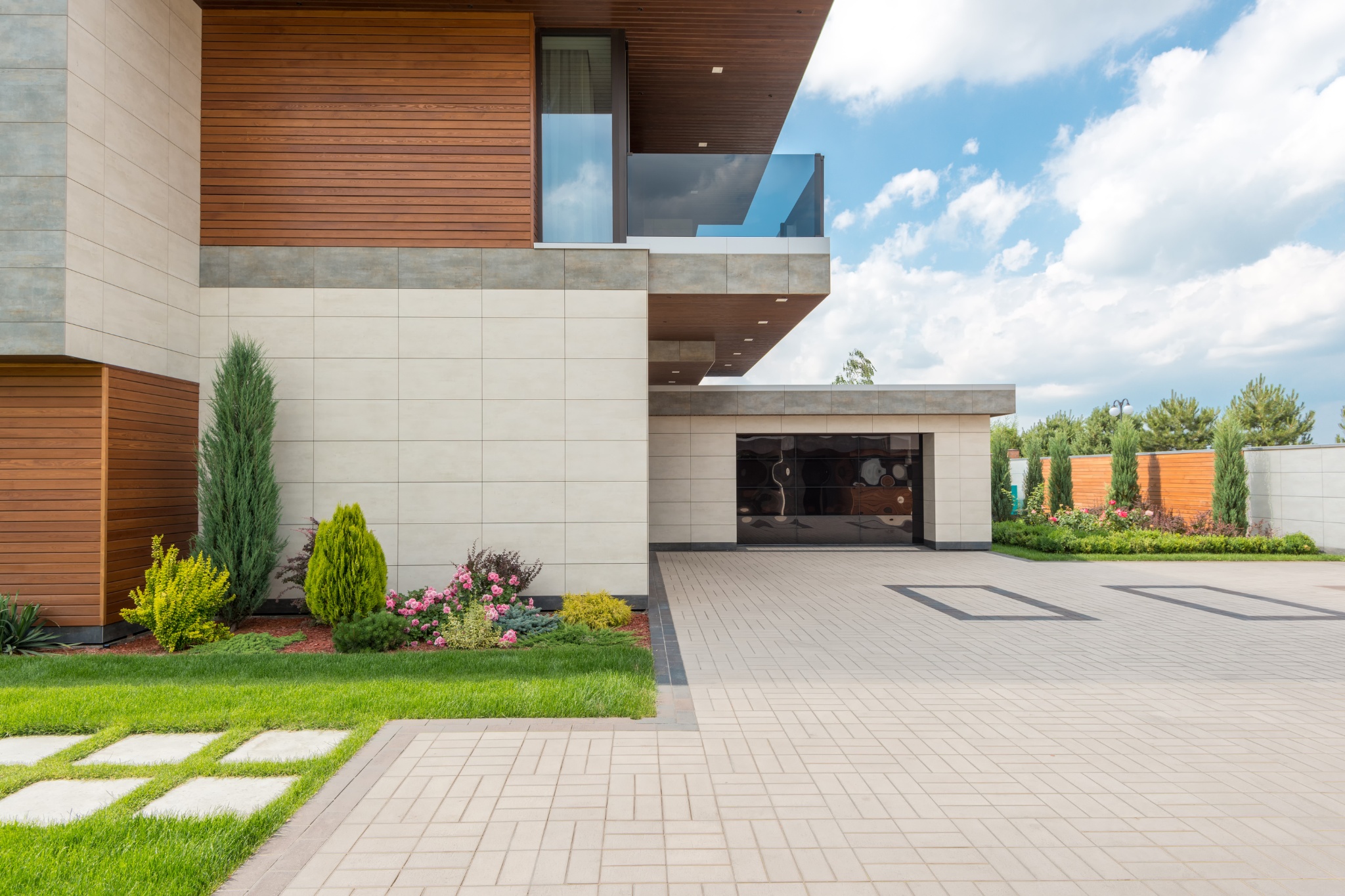 Modern sustainable design build practices showcased in a residential property with landscaping