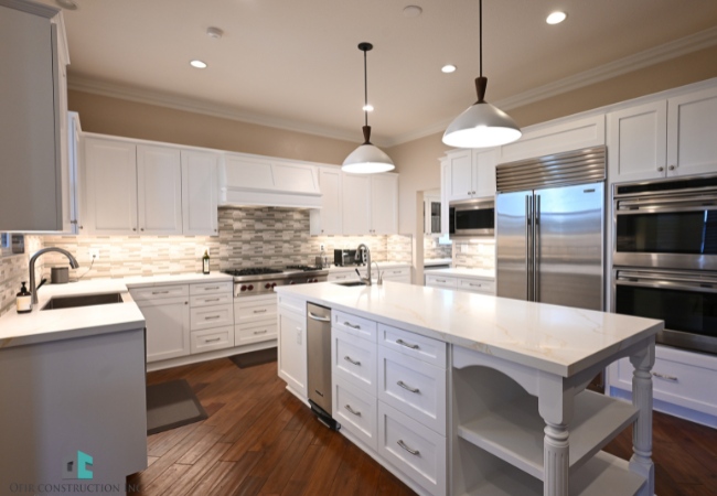 Custom kitchen remodeling showcasing modern design with dark cabinetry and polished wood flooring