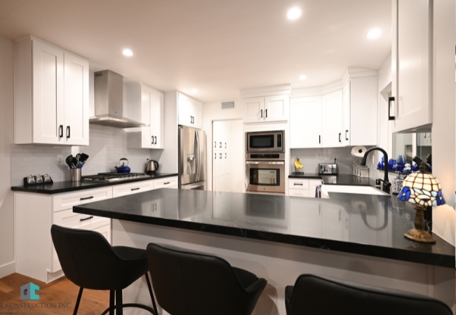 Kitchen cabinet remodeling in a modern home showcasing elegant wooden cabinets and granite countertops